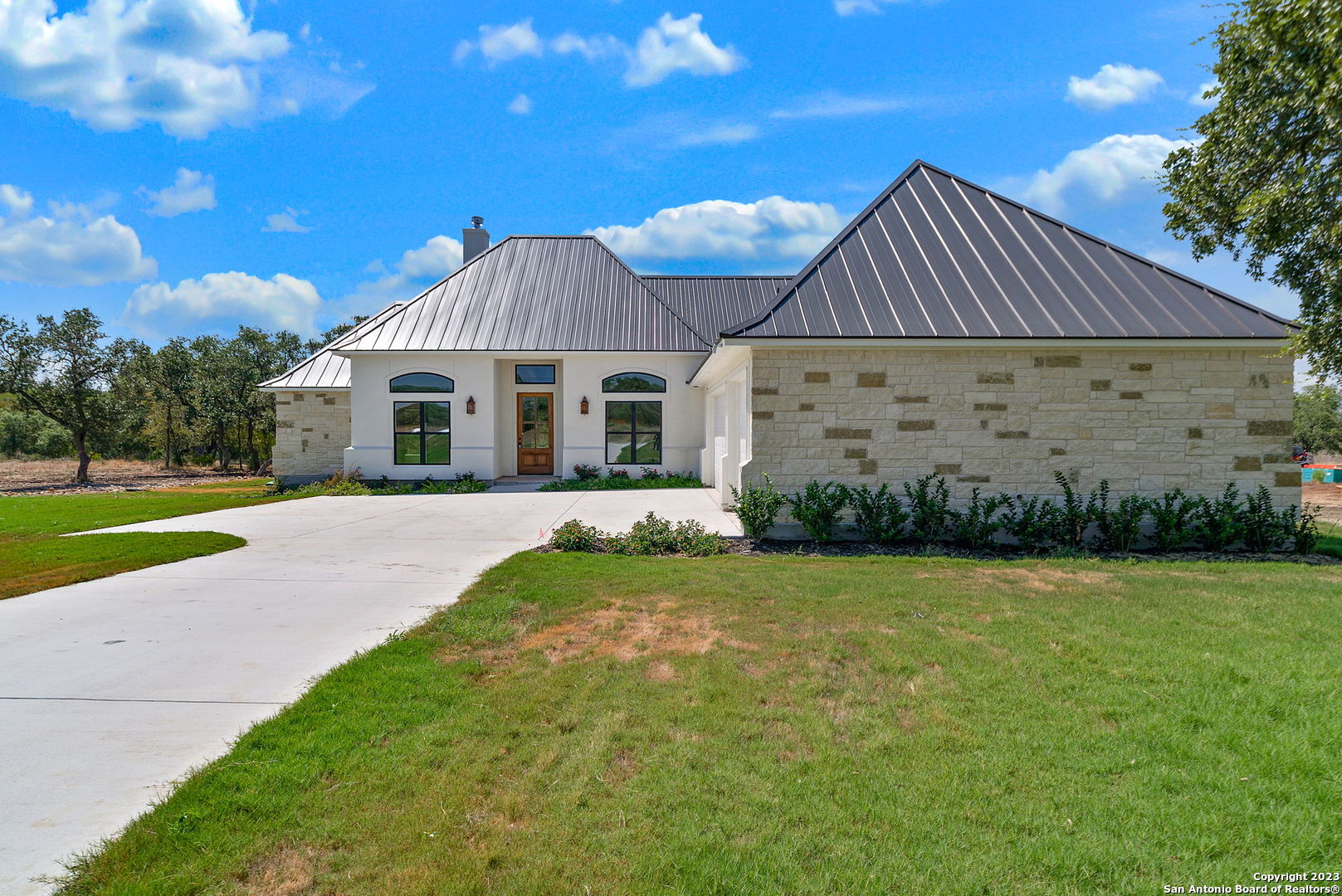 839 Stone Loop Castroville, TX 78009 - Photo 1 of 1 a front view of a house with a yard