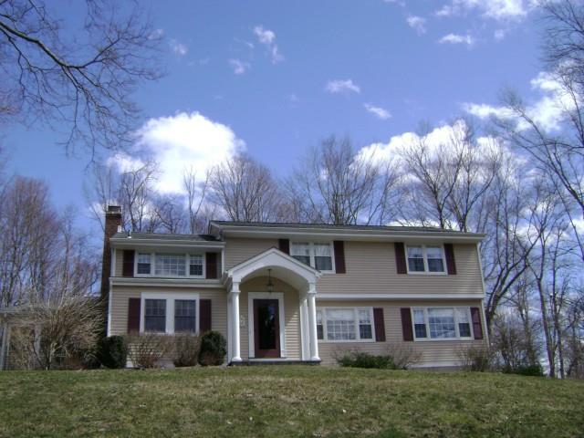 90 Remington Road Ridgefield, CT 06877 - Photo 1 of 1 a front view of a house with garden