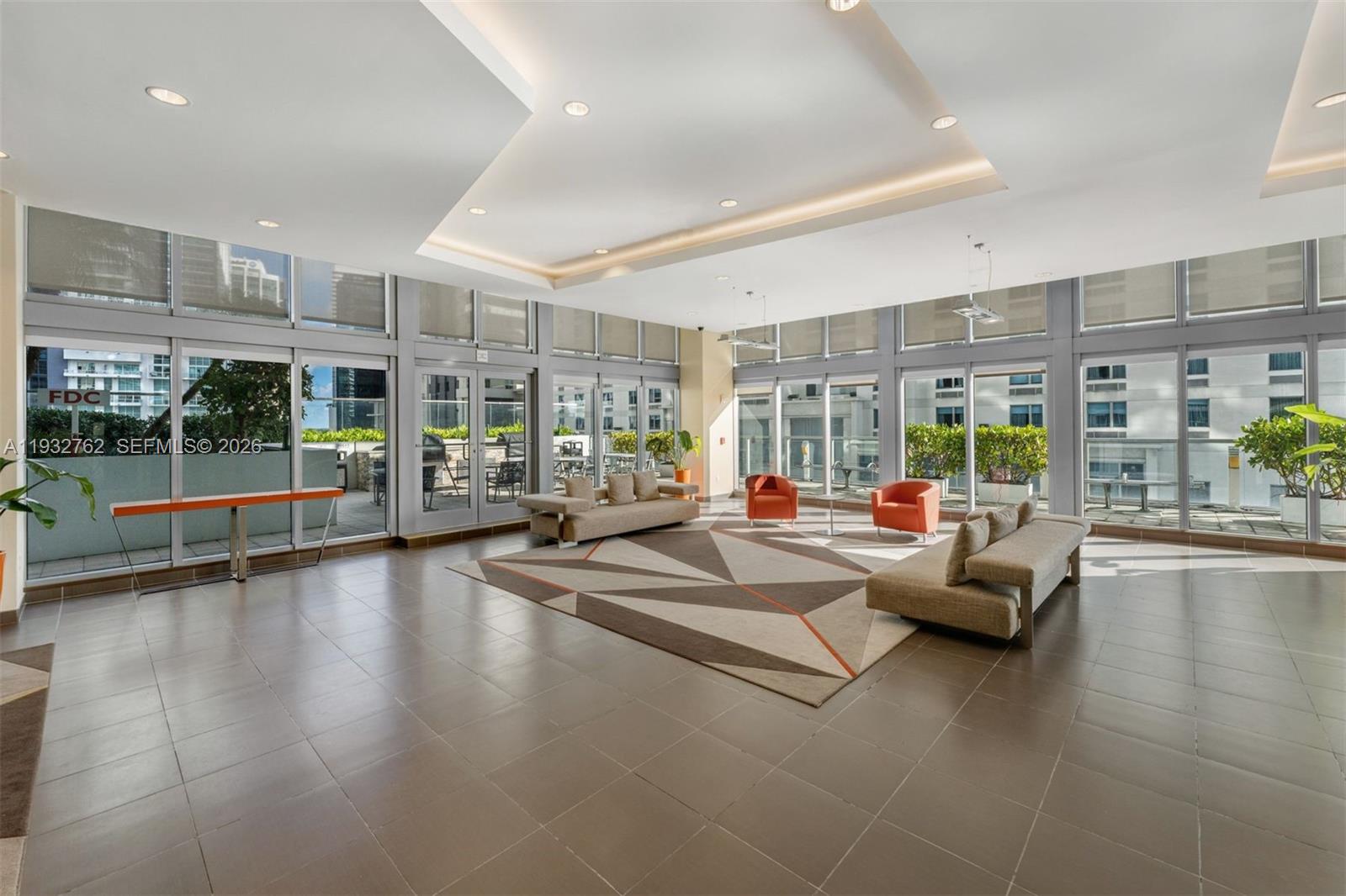 1111 Southwest 1st Avenue, Unit 721N Miami, FL 33130 - Photo 28 of 41 a view of lobby with furniture and floor to ceiling window
