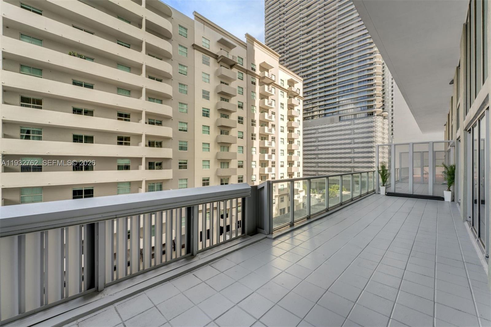 1111 Southwest 1st Avenue, Unit 721N Miami, FL 33130 - Photo 7 of 41 a view of a balcony with wooden floor and fence