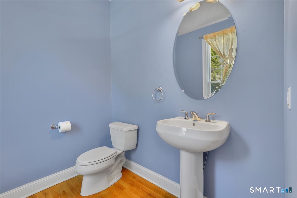 25 Fenwick Drive Avon, CT 06001 - Photo 19 of 40 a bathroom with a sink and mirror