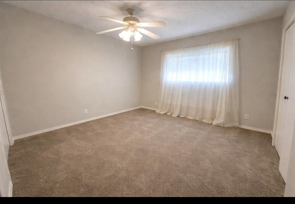 2302 Shiloh Street Denison, TX 75020 - Photo 10 of 16 a view of an empty room with a window