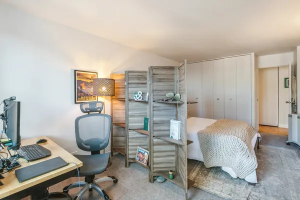 a workspace with furniture and a window