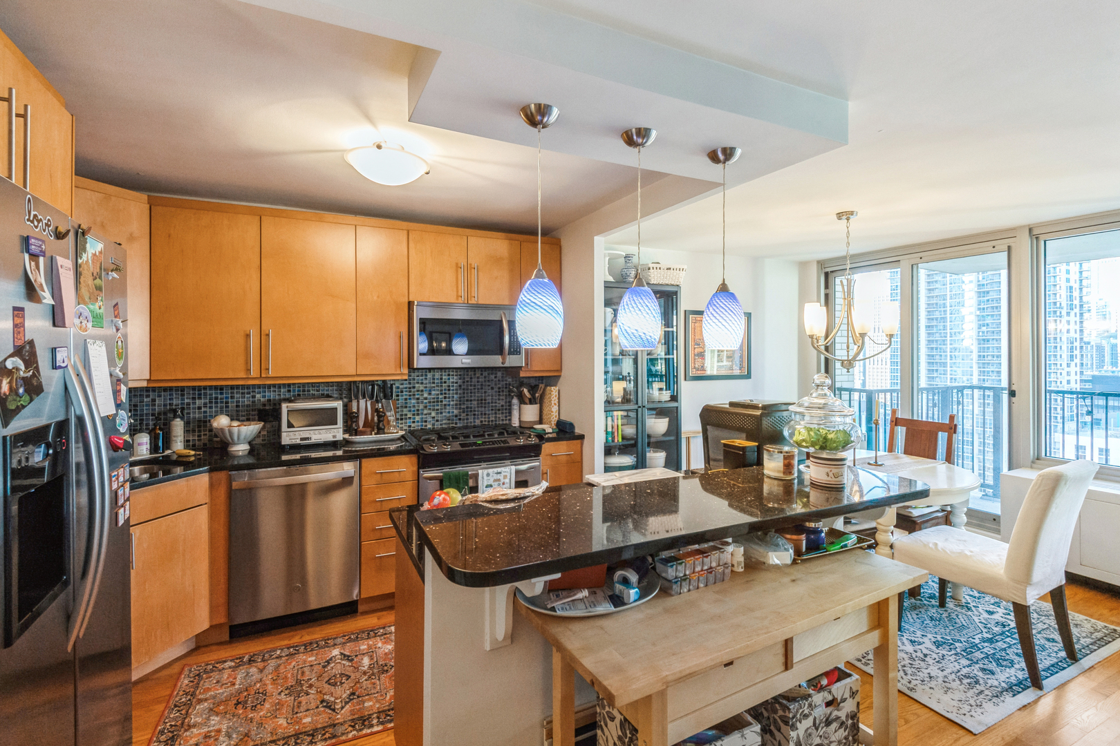 400 East Randolph Street, Unit 2518 Chicago, IL 60601 - Photo 3 of 49 a dining hall with stainless steel appliances granite countertop a stove and cabinets