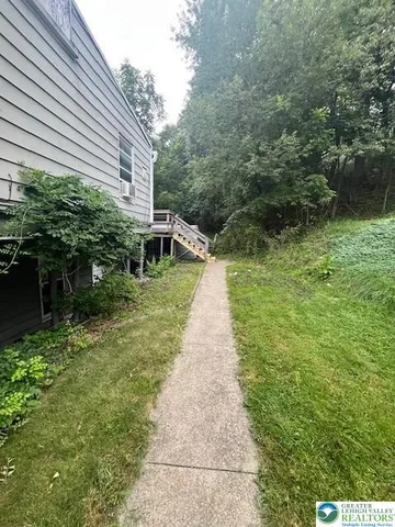 a backyard of a house with lots of green space