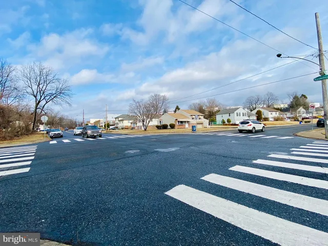 a view of city street with lots of green space