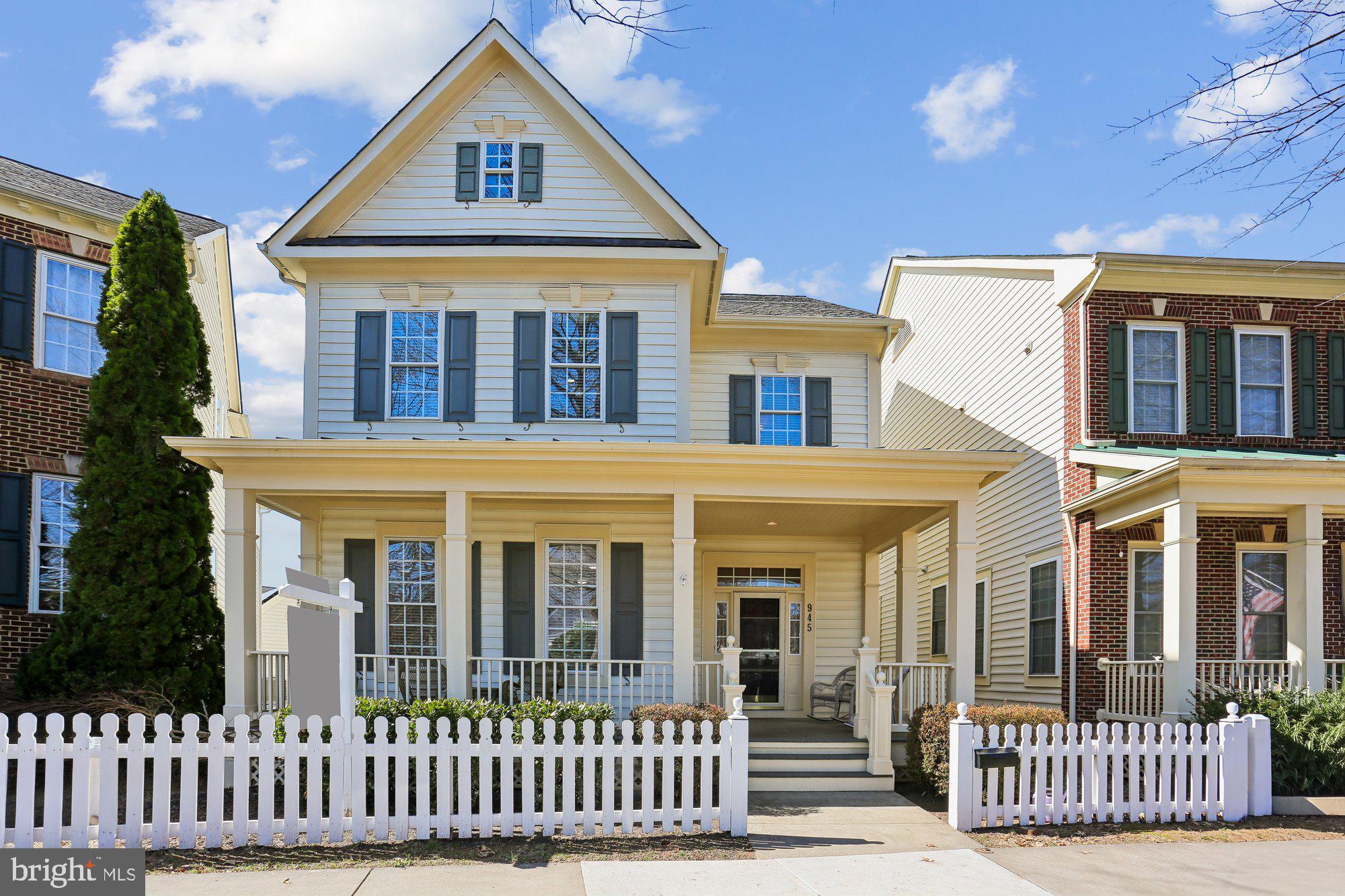front view of a brick house with a porch