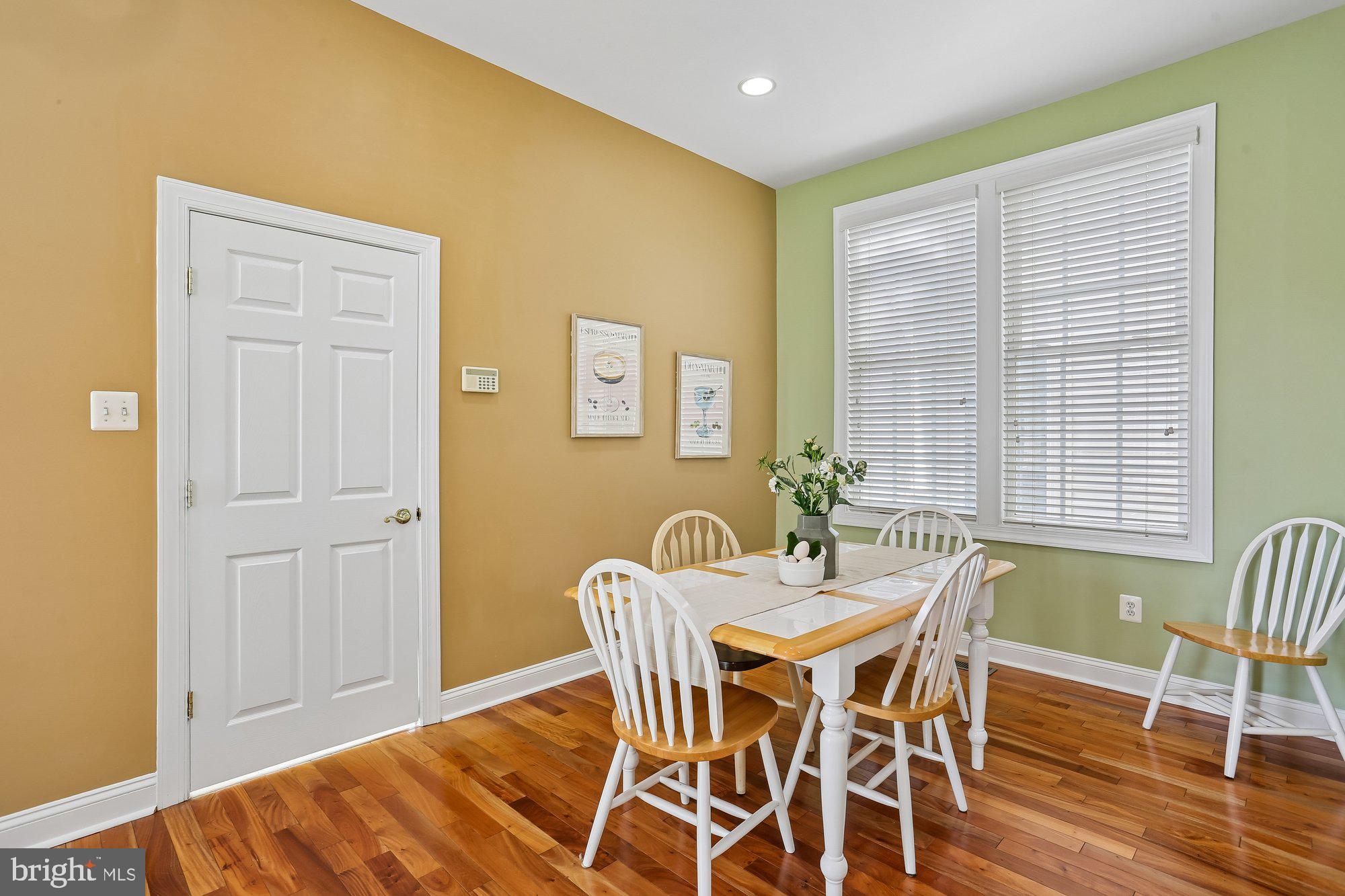 945 Main Street Gaithersburg, MD 20878 - Photo 12 of 57 a view of a dining room with furniture and wooden floor