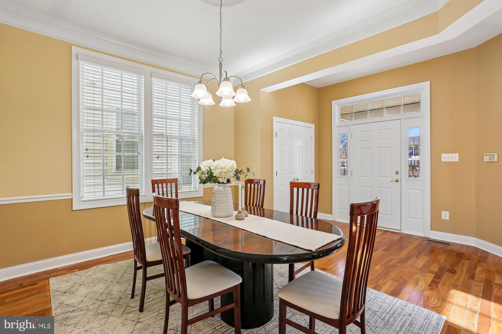 945 Main Street Gaithersburg, MD 20878 - Photo 15 of 57 a view of a dining room with furniture window and wooden floor
