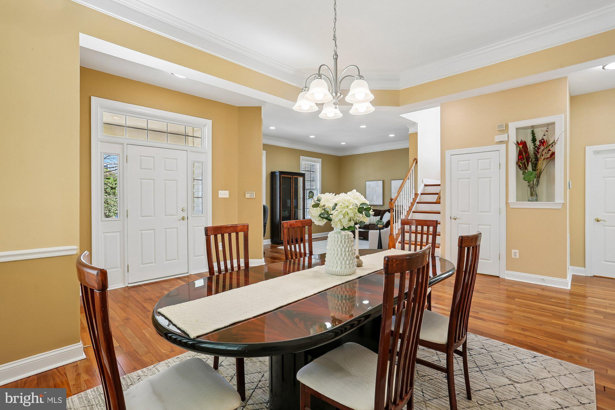 945 Main Street Gaithersburg, MD 20878 - Photo 16 of 57 a view of a dining room with furniture wooden floor and chandelier