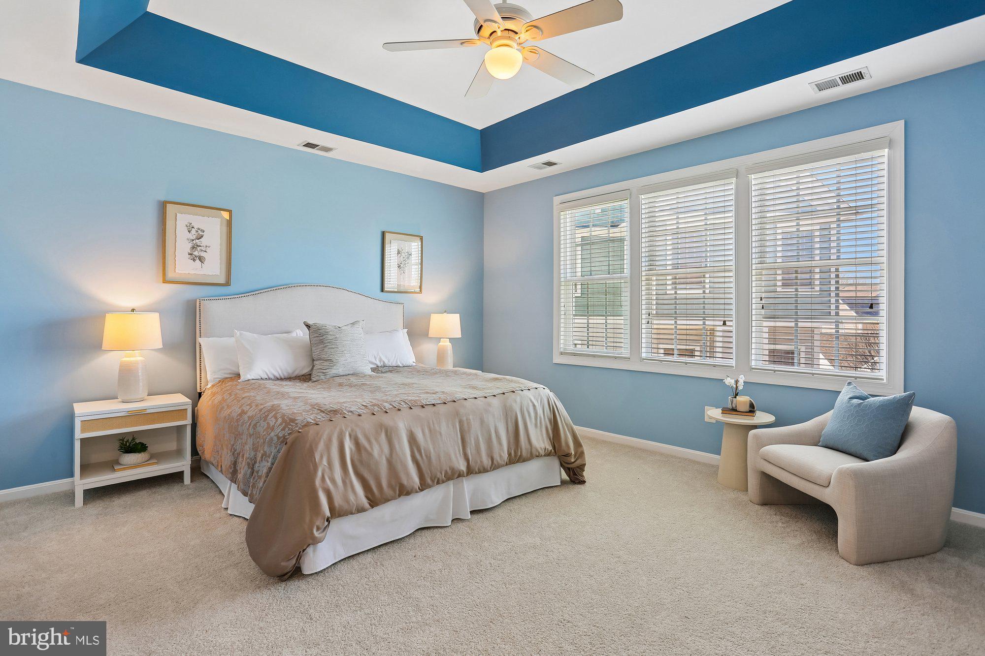 945 Main Street Gaithersburg, MD 20878 - Photo 23 of 57 a spacious bedroom with a bed and a window