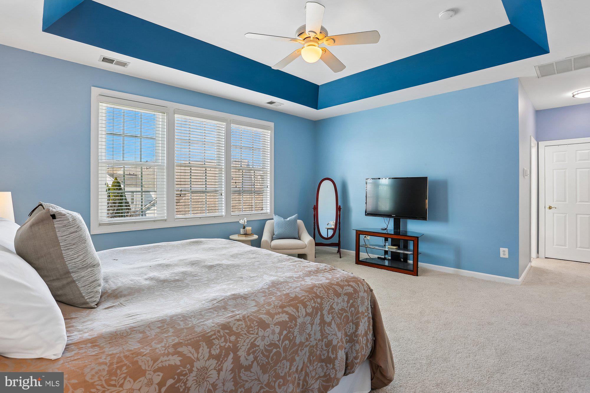 945 Main Street Gaithersburg, MD 20878 - Photo 24 of 57 a bedroom with a bed and a flat screen tv