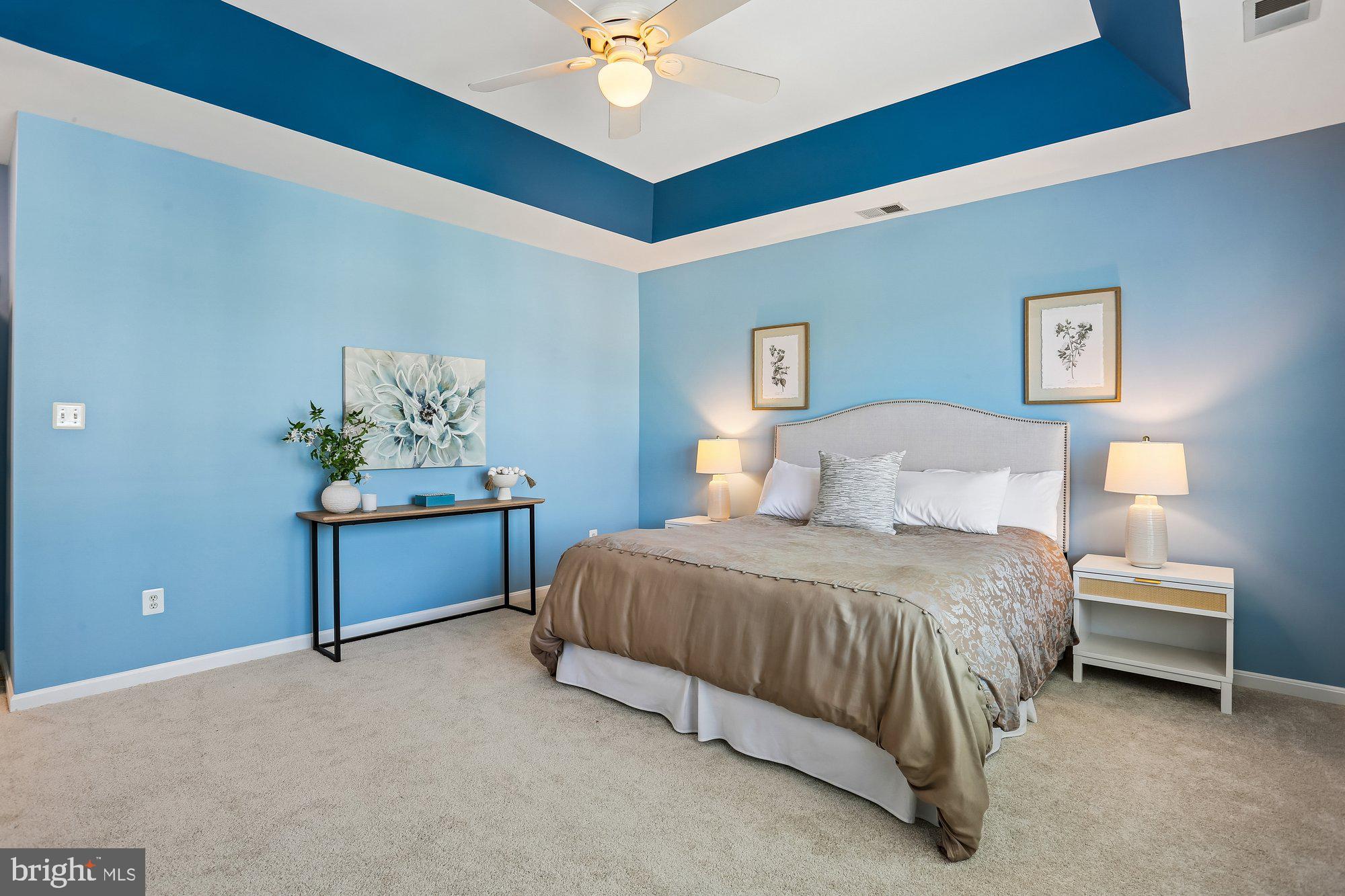 945 Main Street Gaithersburg, MD 20878 - Photo 25 of 57 a bedroom with a bed and a chandelier