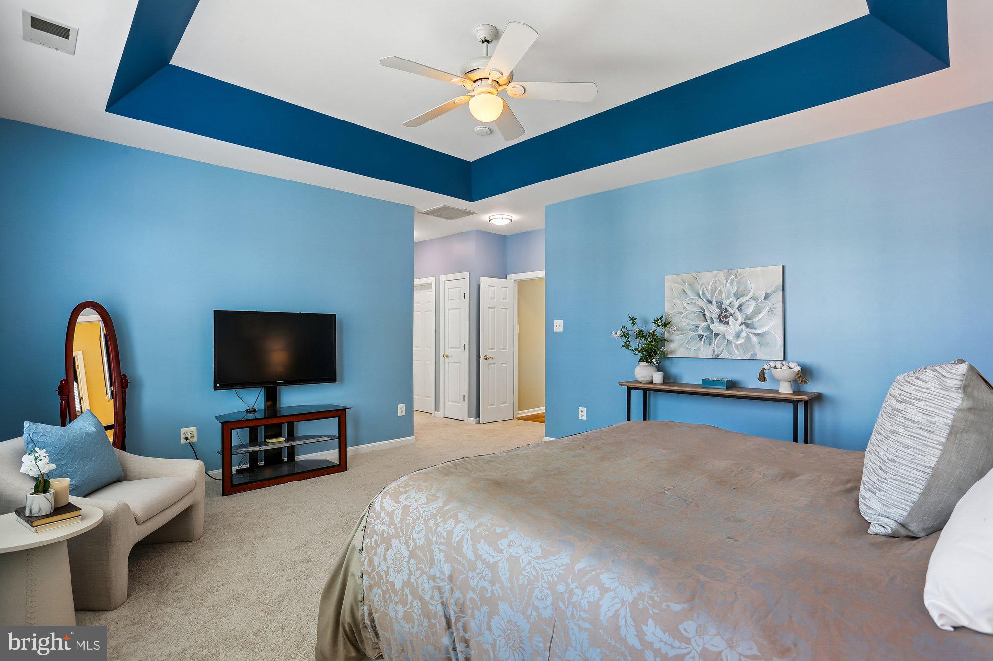 945 Main Street Gaithersburg, MD 20878 - Photo 26 of 57 a bedroom with a bed and a flat screen tv