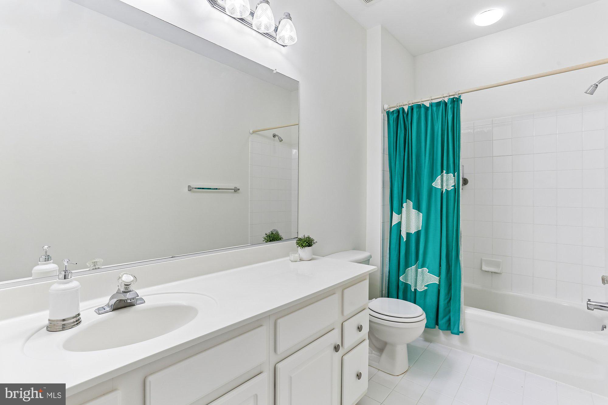 945 Main Street Gaithersburg, MD 20878 - Photo 44 of 57 a bathroom with a sink toilet and shower