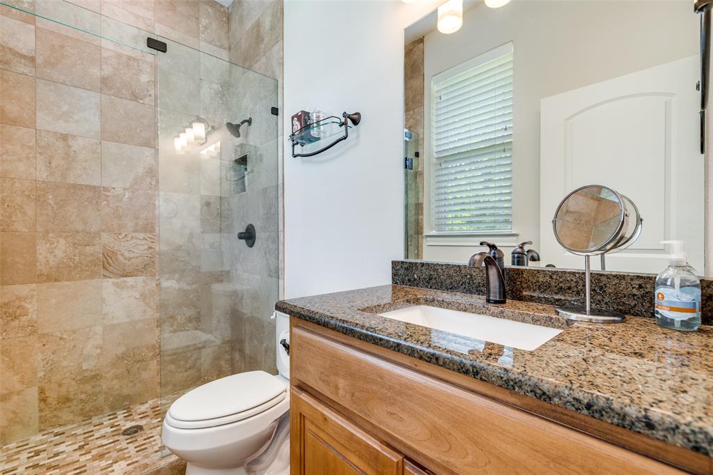 643 County Road 2255 Telephone, TX 75488 - Photo 25 of 40 Full bathroom featuring vanity and a walk in shower