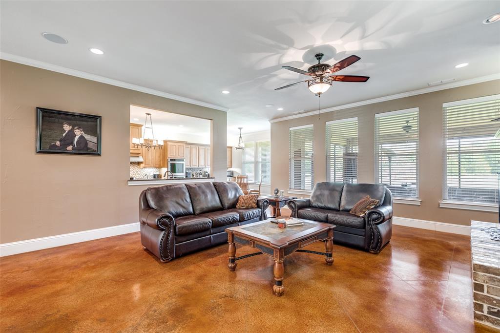 643 County Road 2255 Telephone, TX 75488 - Photo 7 of 40 Living room with crown molding, finished concrete flooring, recessed lighting, and ceiling fan