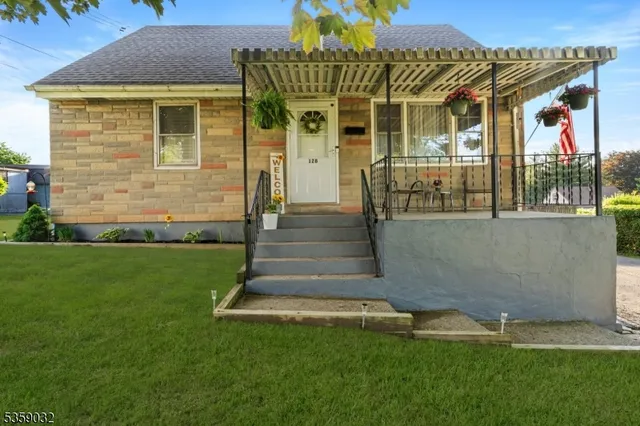 a view of a house with potted plants