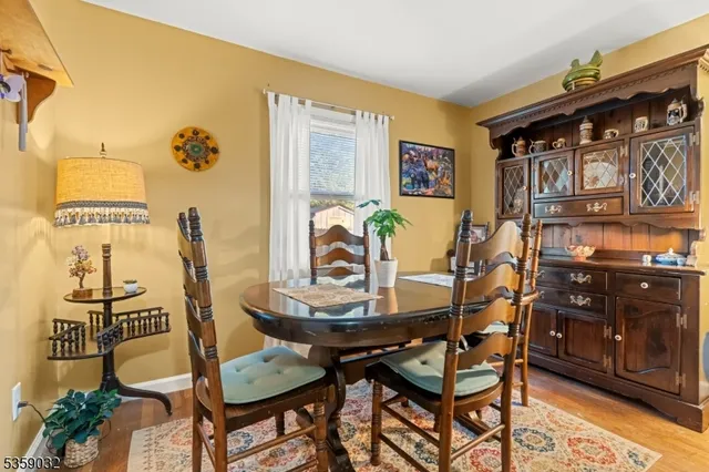 a view of a dining room with furniture and chandelier