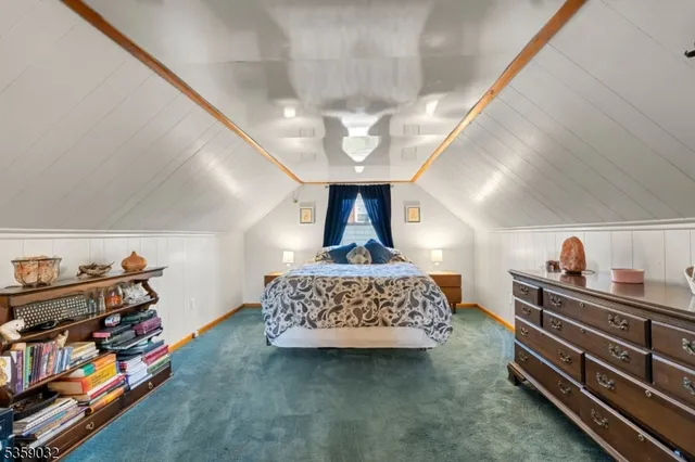 a bed room with a bed and a baby crib