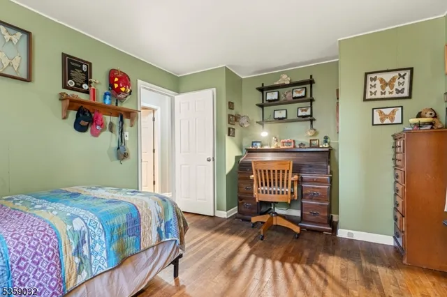 a bedroom with a bed and a table in it