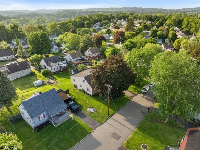 an aerial view of a house with a garden