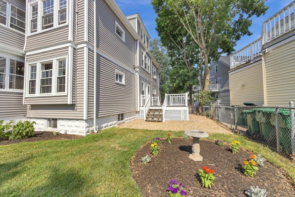 1540 Mystic Valley Parkway, Unit 1 Medford, MA 02155 - Photo 16 of 17 a view of a house with backyard and sitting area