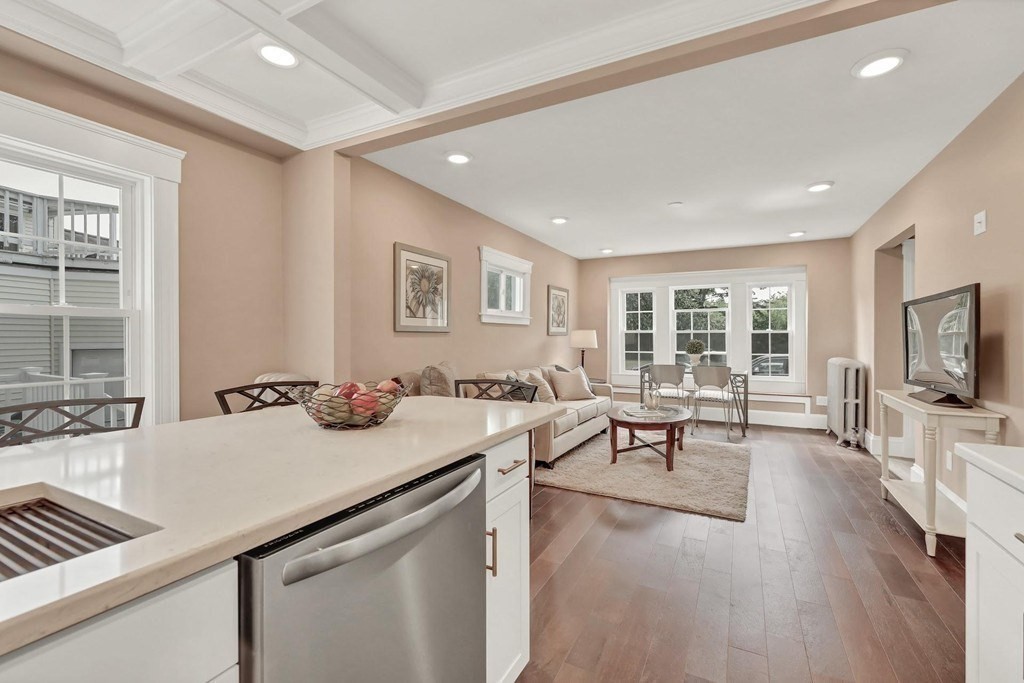 1540 Mystic Valley Parkway, Unit 1 Medford, MA 02155 - Photo 3 of 17 a living room with furniture and a flat screen tv