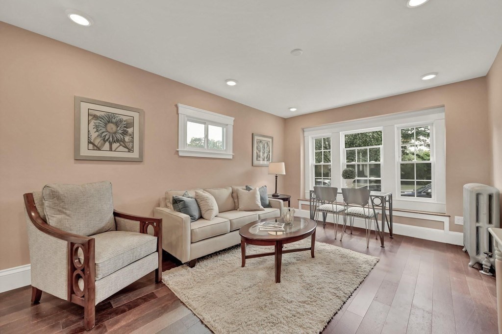 1540 Mystic Valley Parkway, Unit 1 Medford, MA 02155 - Photo 5 of 17 a living room with furniture and a potted plant on table