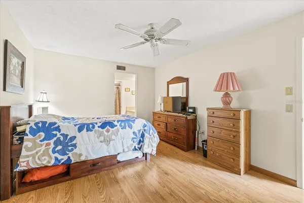 a bedroom with a bed and a dresser