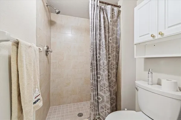 a bathroom with a shower curtain and a sink