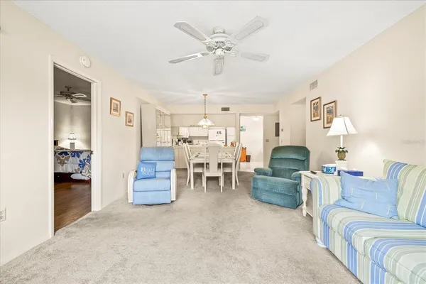 a living room with furniture and white walls