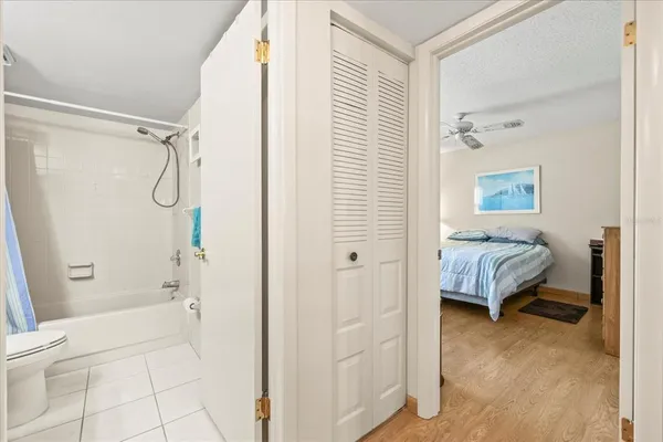 a bathroom with a tub and shower