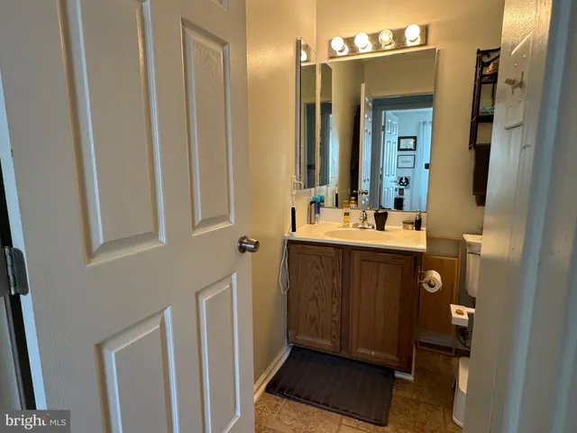 a bathroom with a sink a mirror and a shower