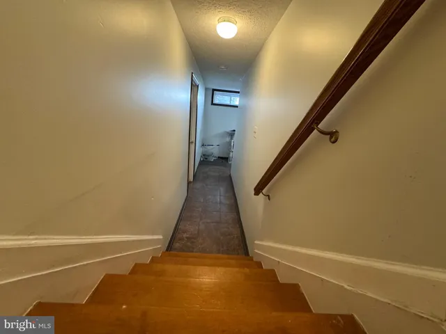 a view of an empty room with stairs