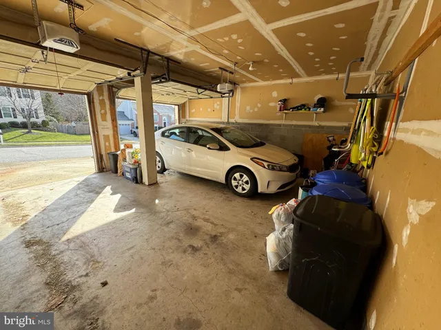 a view of parking garage with cars parked