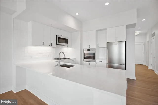 a kitchen with a stove and a microwave