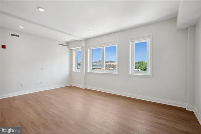 a view of kitchen with wooden floor