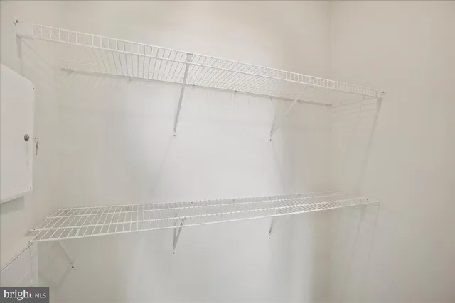 a white bath tub sitting next to a white toilet and a shower