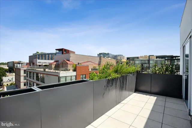 a view of a room with a hallway and a closet