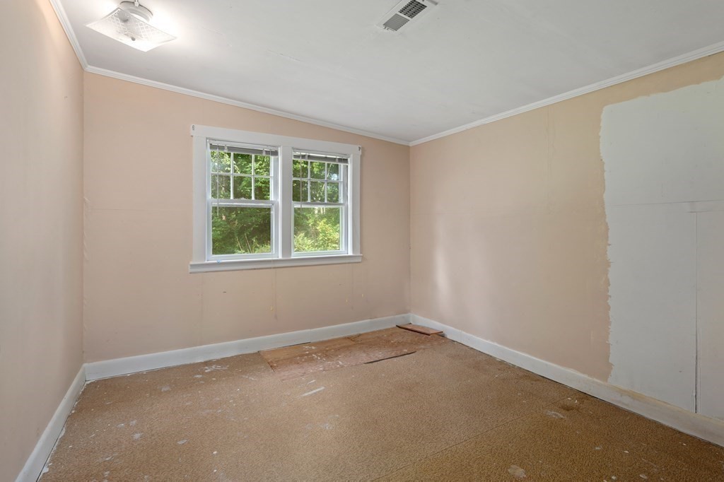 163 Topsfield Road Ipswich, MA 01938 - Photo 12 of 29 an empty room with a window