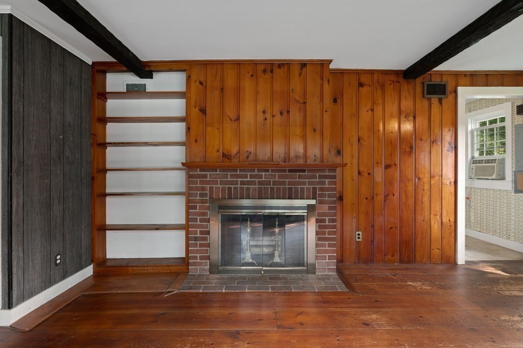 163 Topsfield Road Ipswich, MA 01938 - Photo 16 of 29 a view of an empty room with wooden floor fireplace and a window
