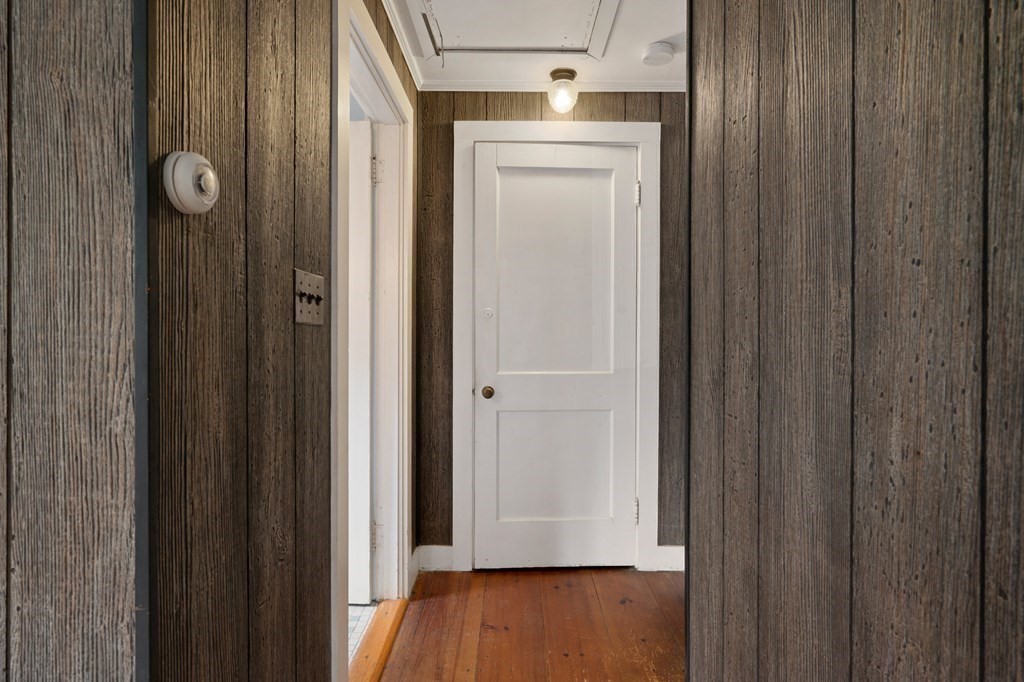 163 Topsfield Road Ipswich, MA 01938 - Photo 17 of 29 a view of a hallway with wooden floor
