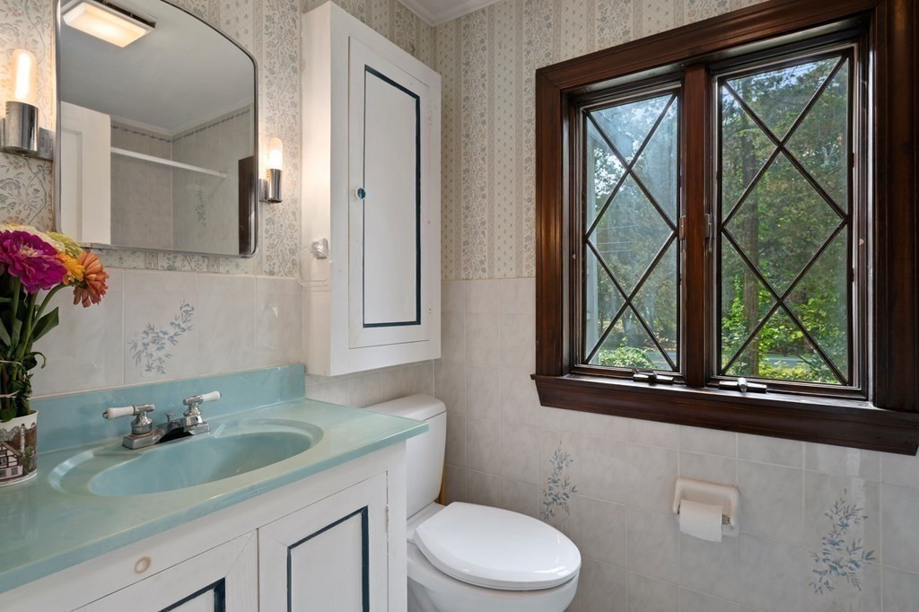 163 Topsfield Road Ipswich, MA 01938 - Photo 18 of 29 a bathroom with a granite countertop sink mirror vanity and toilet