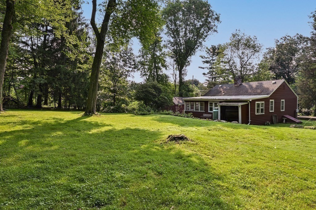 163 Topsfield Road Ipswich, MA 01938 - Photo 27 of 29 a front view of a house with yard and green space