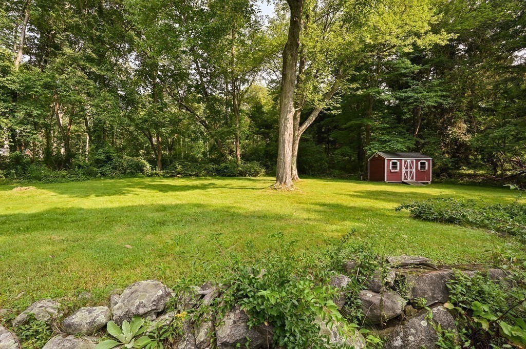 163 Topsfield Road Ipswich, MA 01938 - Photo 28 of 29 a swimming pool with trees in the background