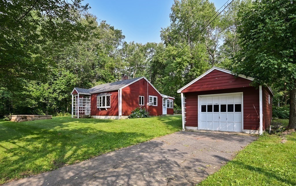 163 Topsfield Road Ipswich, MA 01938 - Photo 29 of 29 a view of a house with a yard and large tree