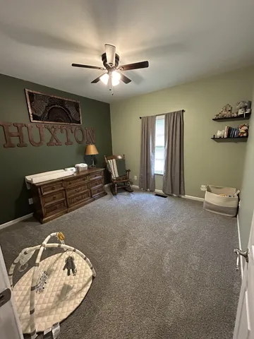 a view of a livingroom with furniture