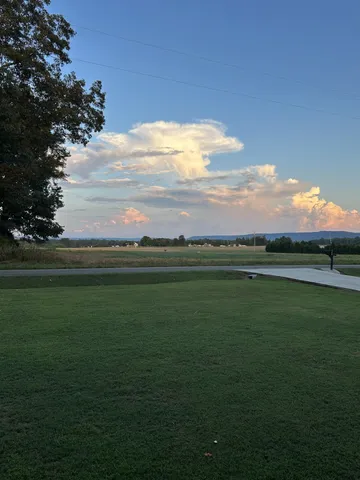 a view of a golf course with a lake