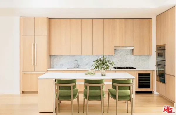 a kitchen with a table and chairs in it